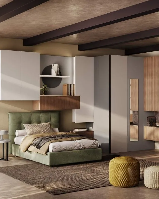 Dettaglio in una cameretta Behome: letto singolo verde salvia, capiente armadio ad angolo ed elementi in legno cannettato.