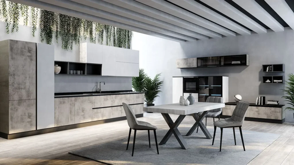 Cucina angolare Dafne Grey di BEHOME con mobili grigio cemento, pensili bianchi, tavolo centrale e tre sedie.