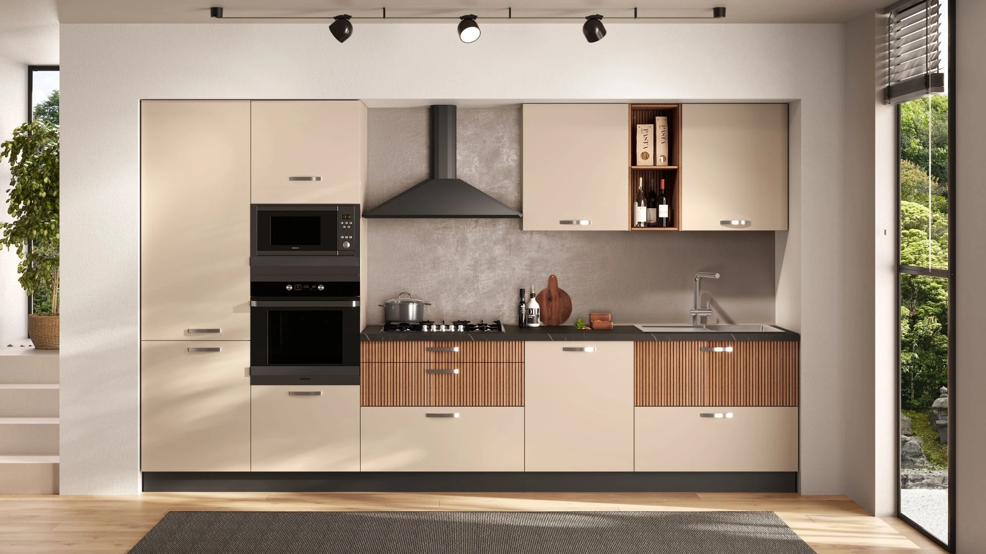 Cucina lineare Palio Gea di BEHOME con mobili beige, cassetti in legno cannettato, cappa nera e doppio forno.