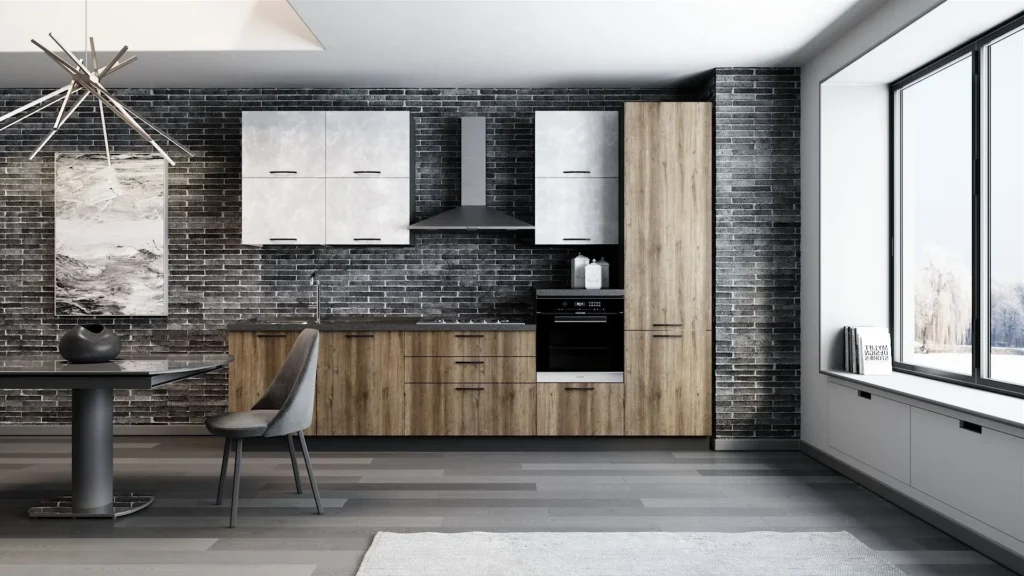 Cucina lineare Palio Prime di BEHOME con basi in legno, pensili chiari, cappa a vista e parete in mattoni scuri.
