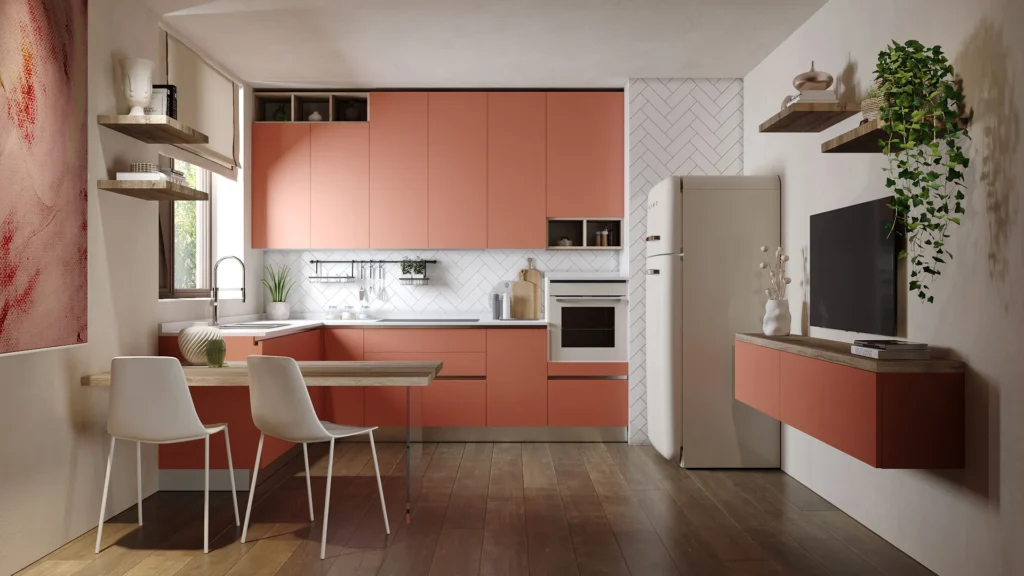 Cucina completa Dafne Elegant color corallo con penisola, sedie bianche, mobile tv sospeso e frigo stile vintage.