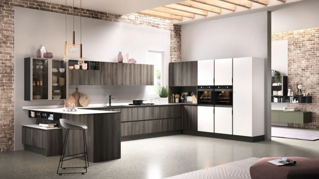 Ampia Cucina con Penisola Dafne Up di BEHOME con basi in legno grigio, top bianco, colonne bianche