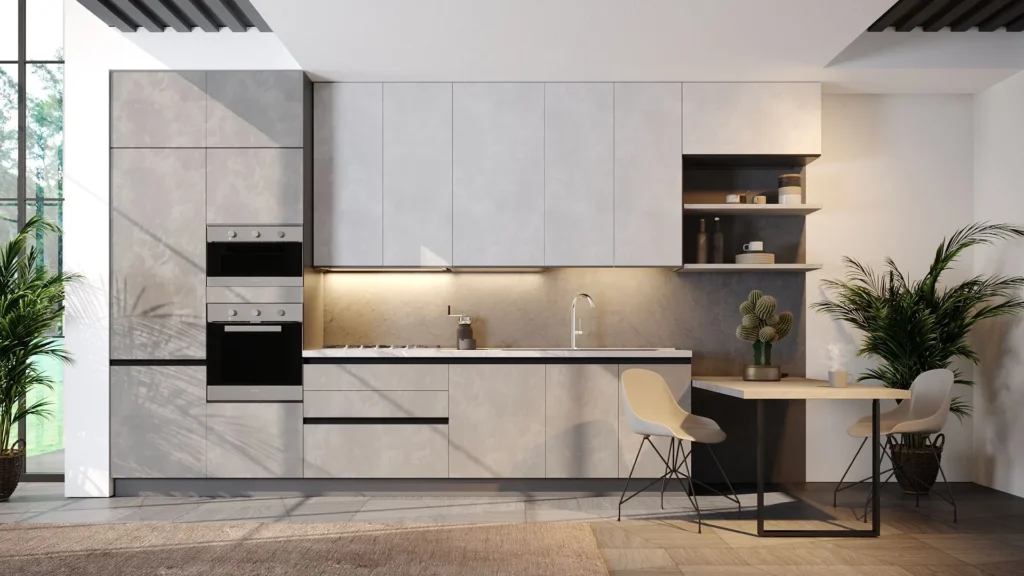 Cucina Con Penisola Karma Full grigia: colonne con doppi forni, top chiaro, tavolo in legno integrato e sedie bianche.