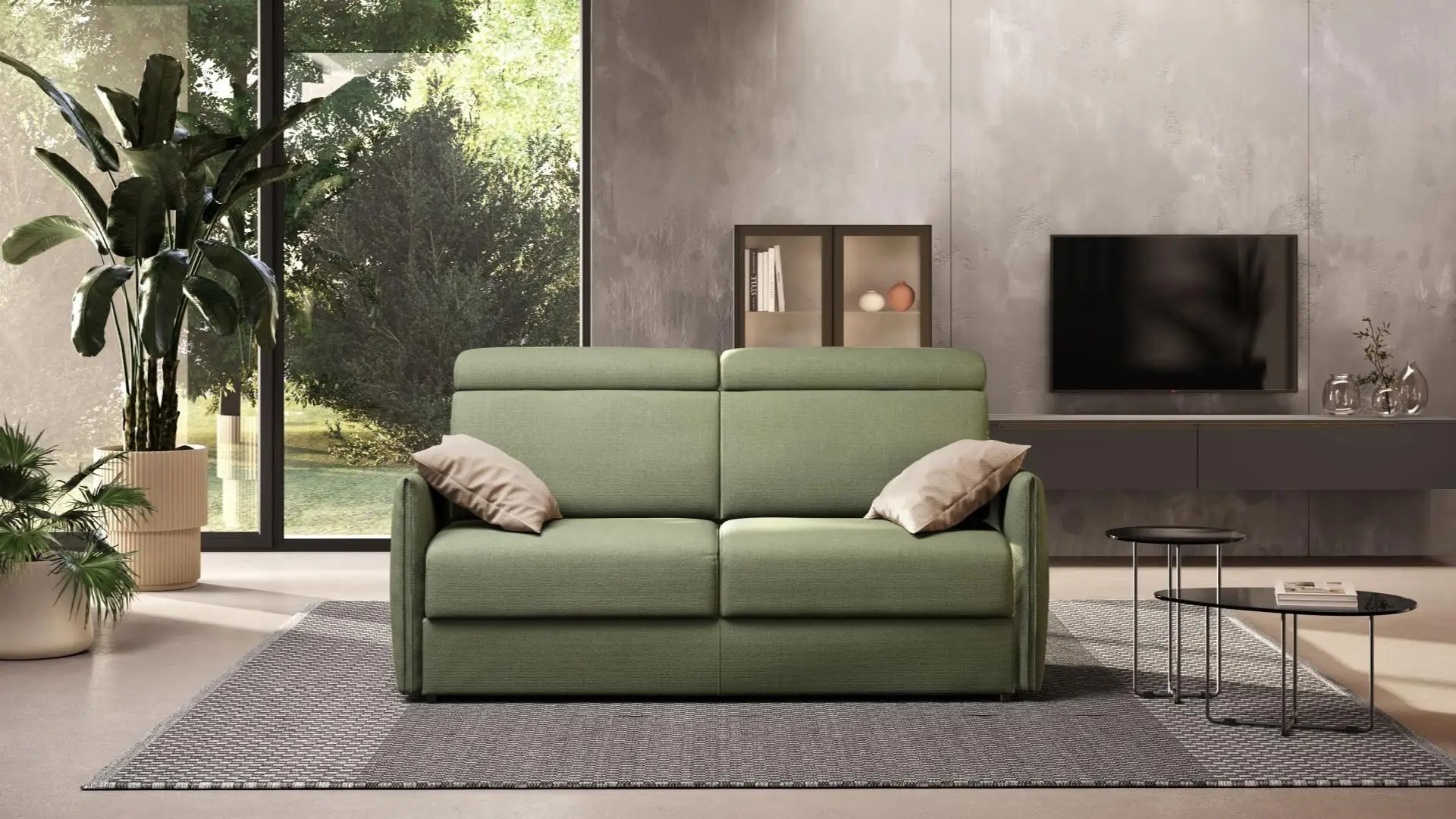 Divano letto a due posti Fever di BEHOME in tessuto verde in un salotto luminoso.