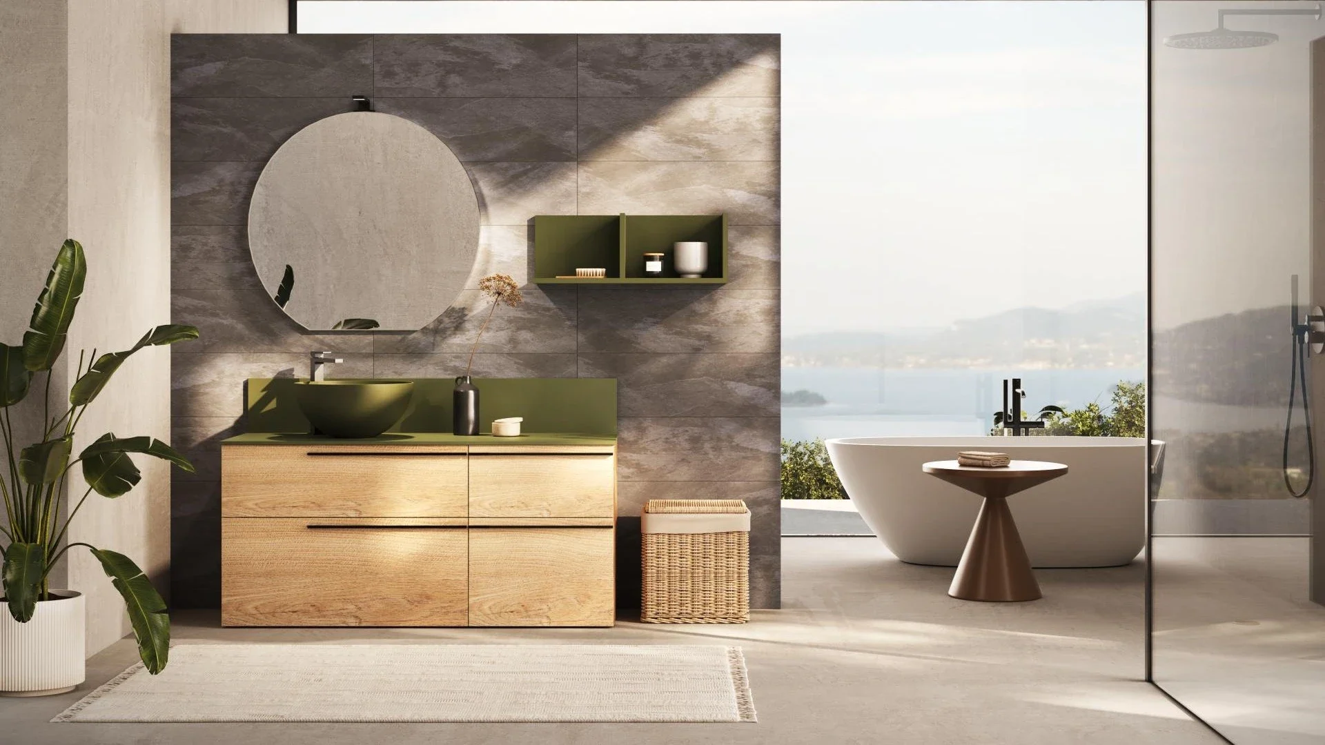 Mobile bagno Forest di BEHOME in legno chiaro con lavabo verde in un bagno moderno.
