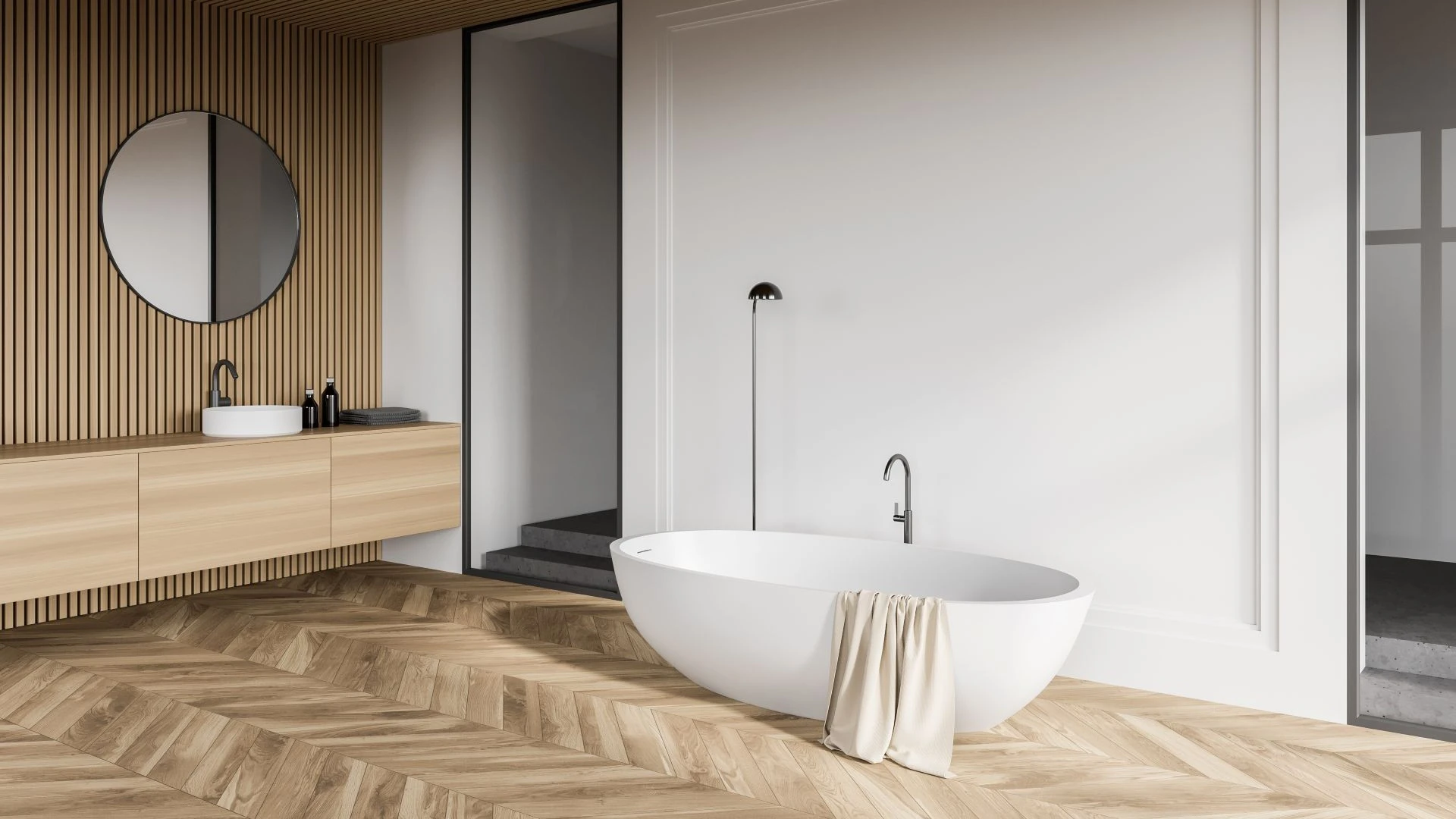 Mobile bagno sospeso Tom di BEHOME in legno chiaro con specchio rotondo.